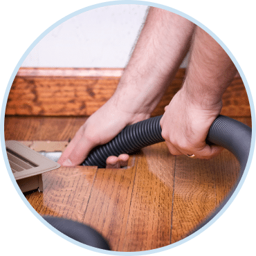 Technician performing duct cleaning Las Vegas service to improve indoor air quality