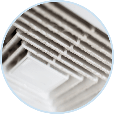 Clean air vent inspected during professional indoor air quality testing service