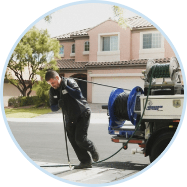 Technician performing hydro jetting in Las Vegas to clear residential sewer lines